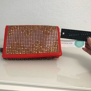 Orange with metal accent clutch/purse